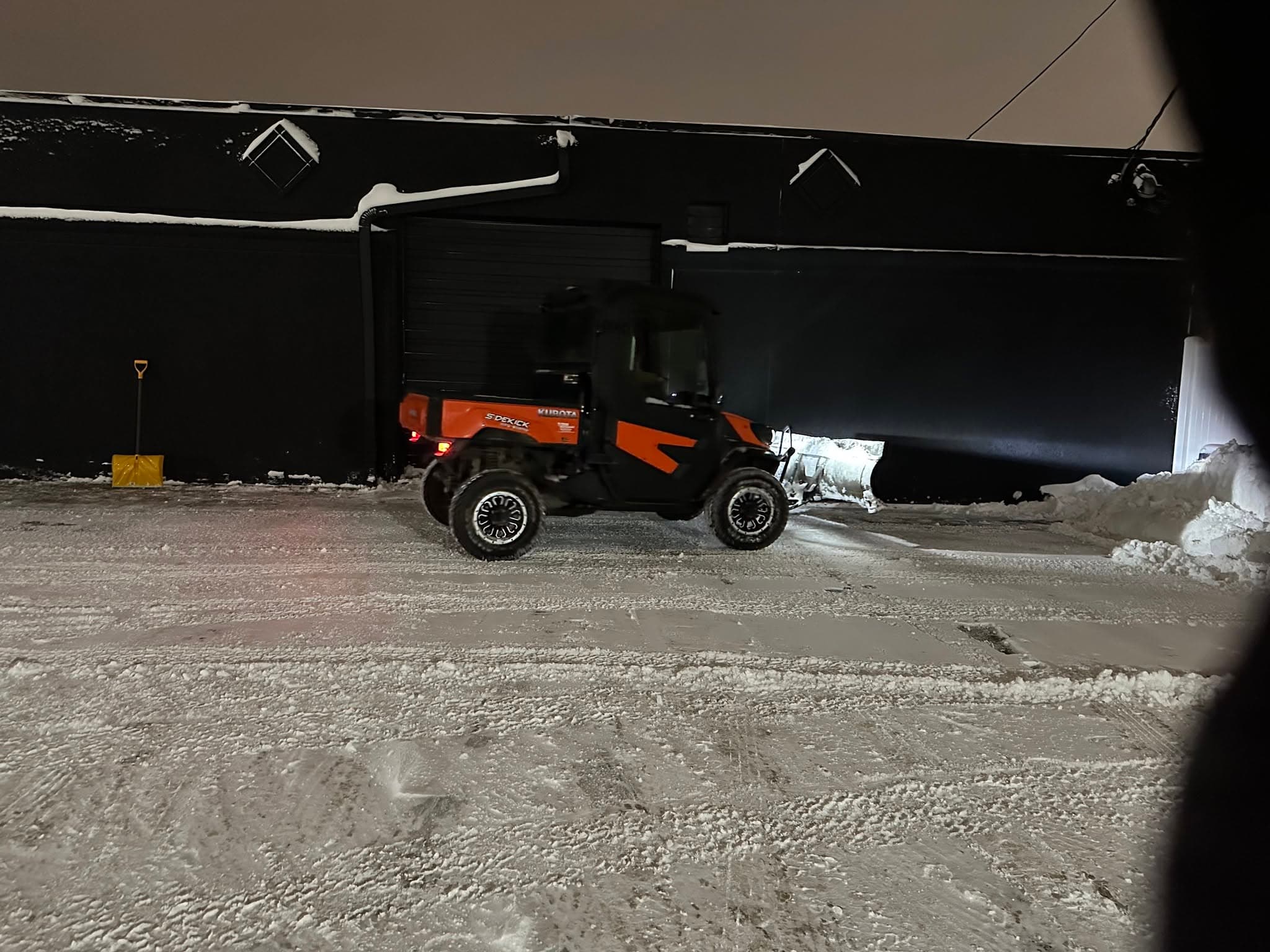 Kubota side-by-side with plow clearing snow — Fargo ND